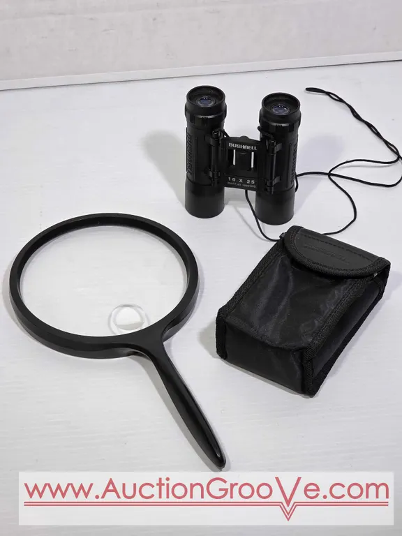 Bushnell 10 x 25 Binoculars and Bausch & Lomb Magnifying Glass. K