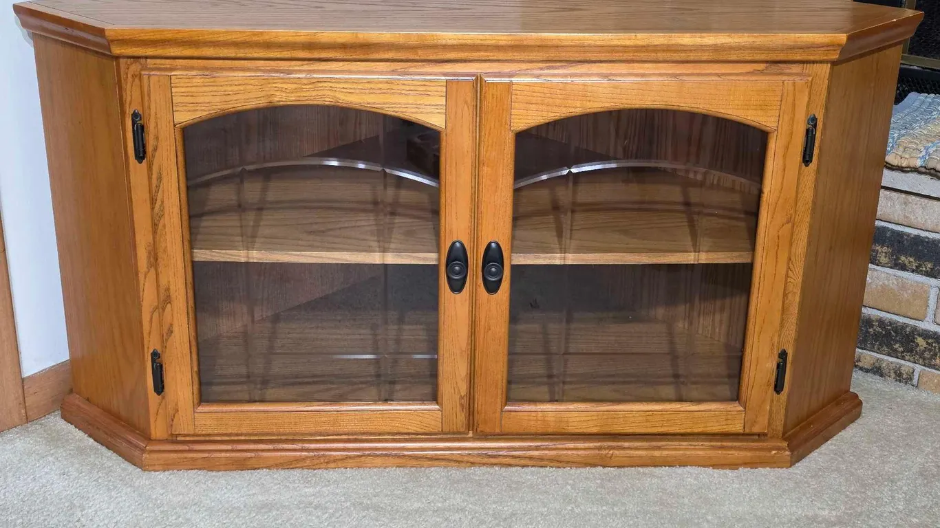 Corner Cabinet Entertainment Center. 47 x 26 x 24. *you must bring adequate help to remove and load. Located on main floor. LR