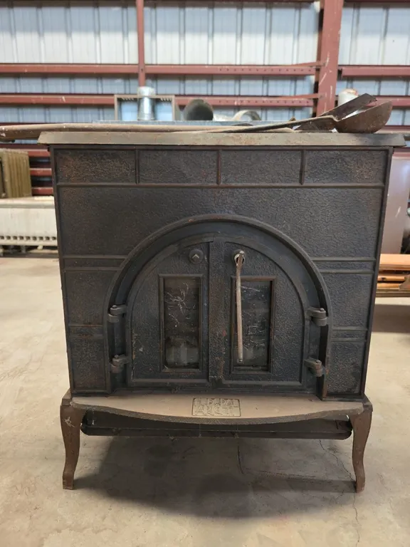 Antique cast iron stove and stove tools