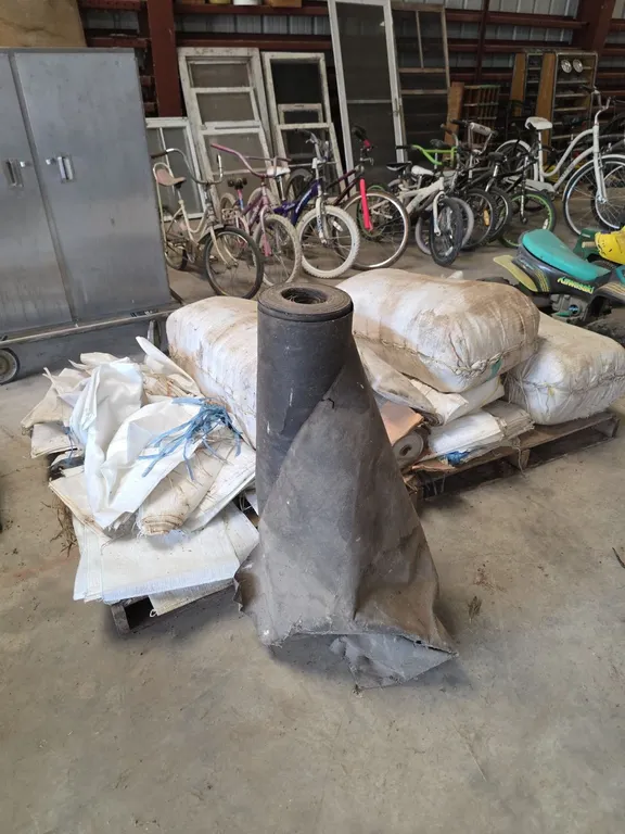 Large quantity of sandbags, plastic and tar paper