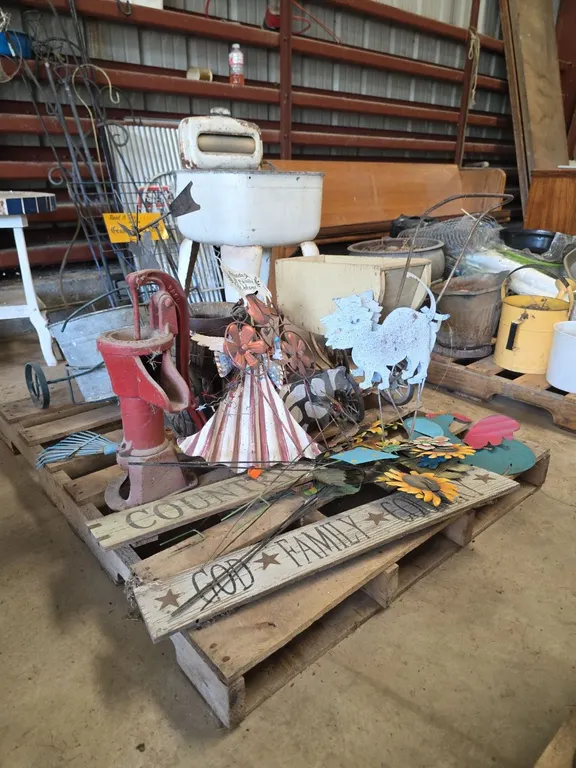 Pallet of rustic decor, signs and hand pump