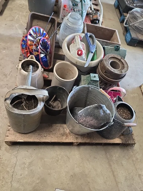 Pallet of flower pots, garden tools and decorations