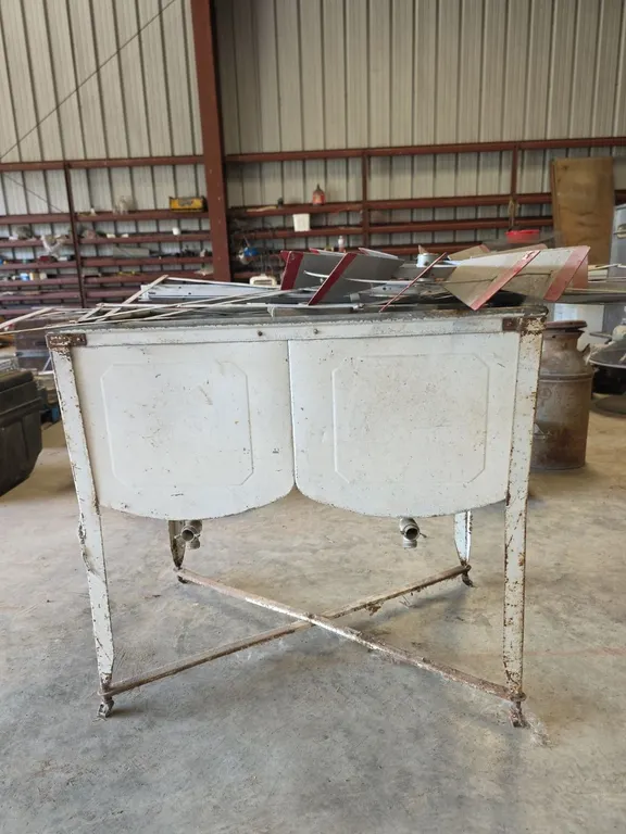 Antique steel washtub and ornamental windmill