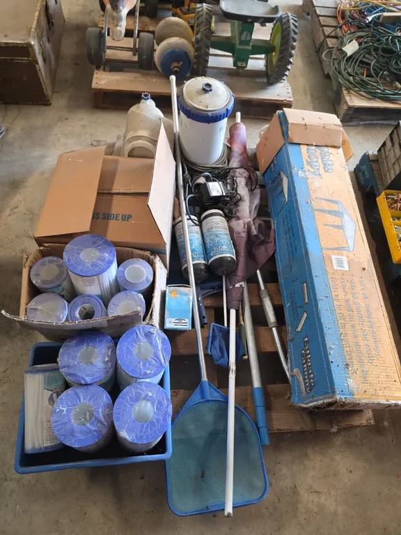 Pallet of swimming pool pumps, parts, accessories and a tailgate canopy
