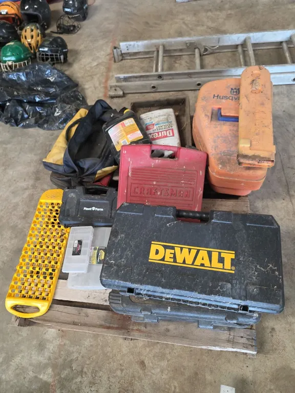 Pallet of empty power tool cases and organizers