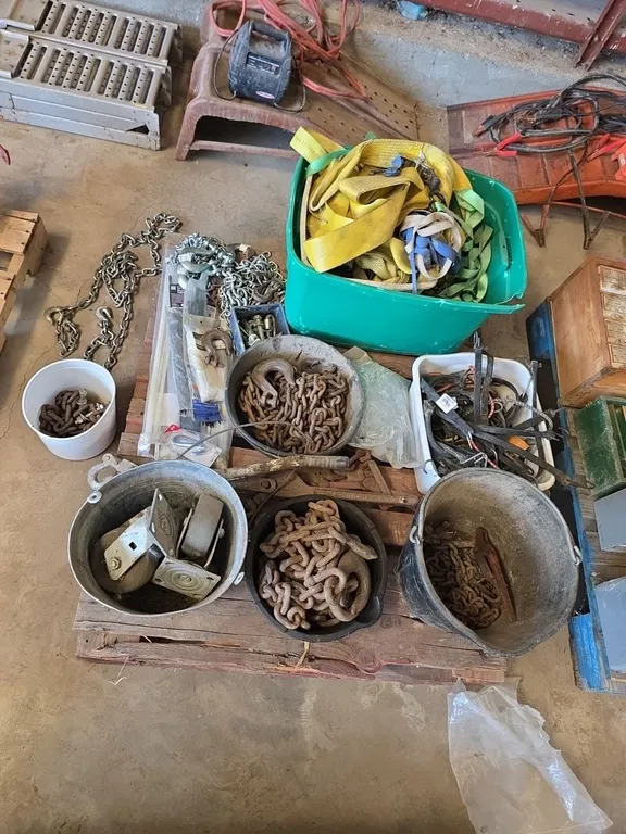 Large quantity of chains, ratchet straps, caster wheels, zip ties, chain ends, bungee cords, chain binders and come along