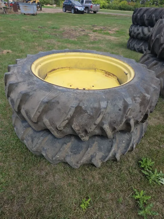 Pair of firestone 13.6-38 duals on John deere rims