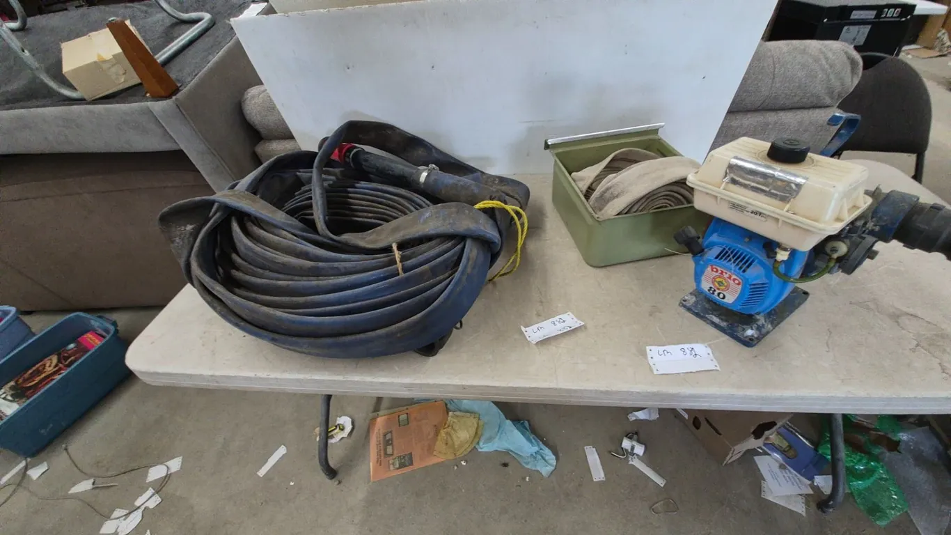 Prio 80 Water Pump, Rolled Blue Hose, and Green Bin with Rolled Canvas Hoses