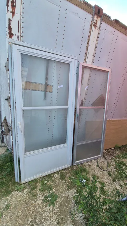 Two White Aluminum Storm Doors, One with Glass, One with Screen and Glass
