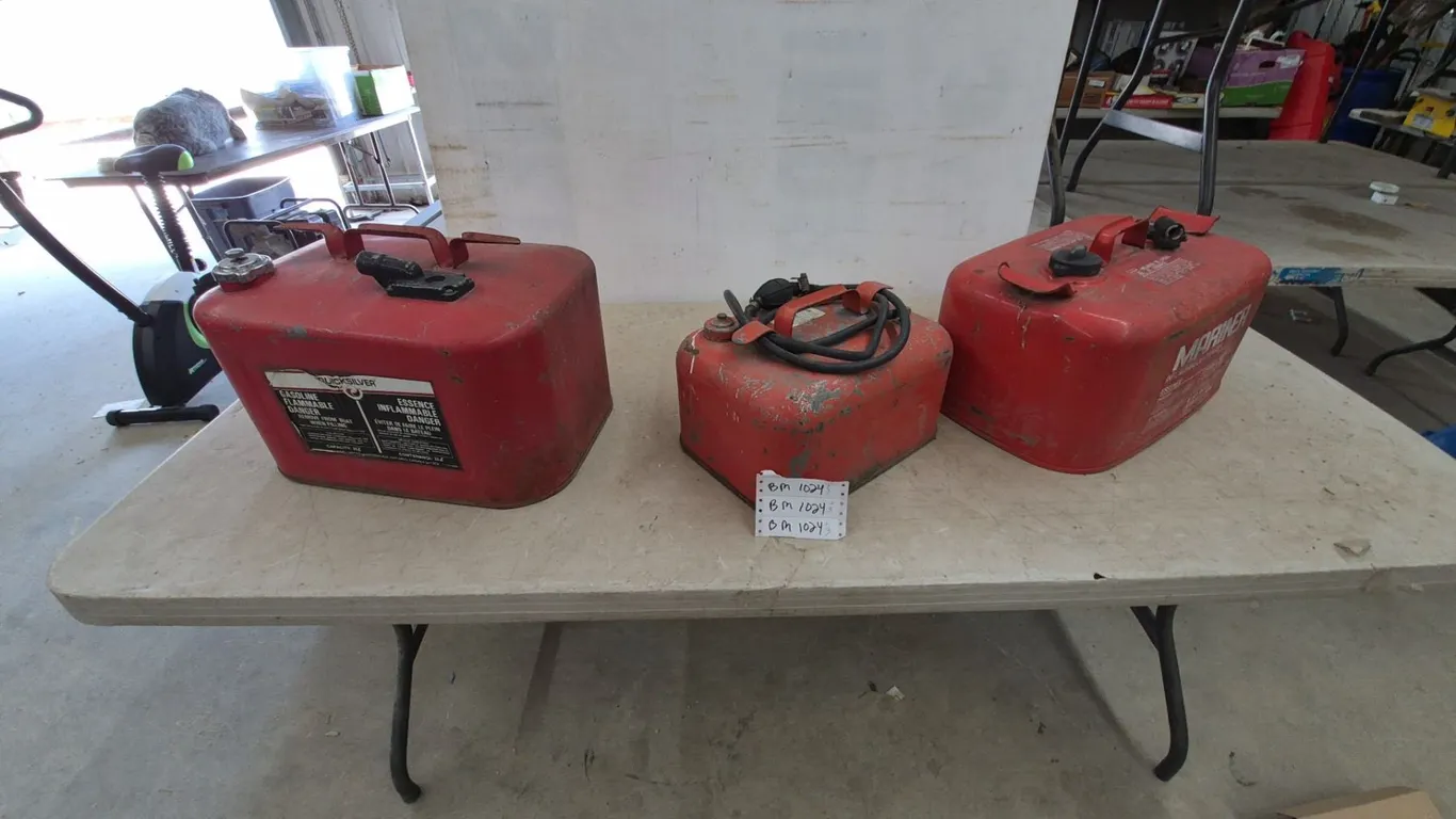 Three Outboard Motor Fuel Tanks: Quicksilver 3 Gal, Mariner, and Unbranded Tank with Hose