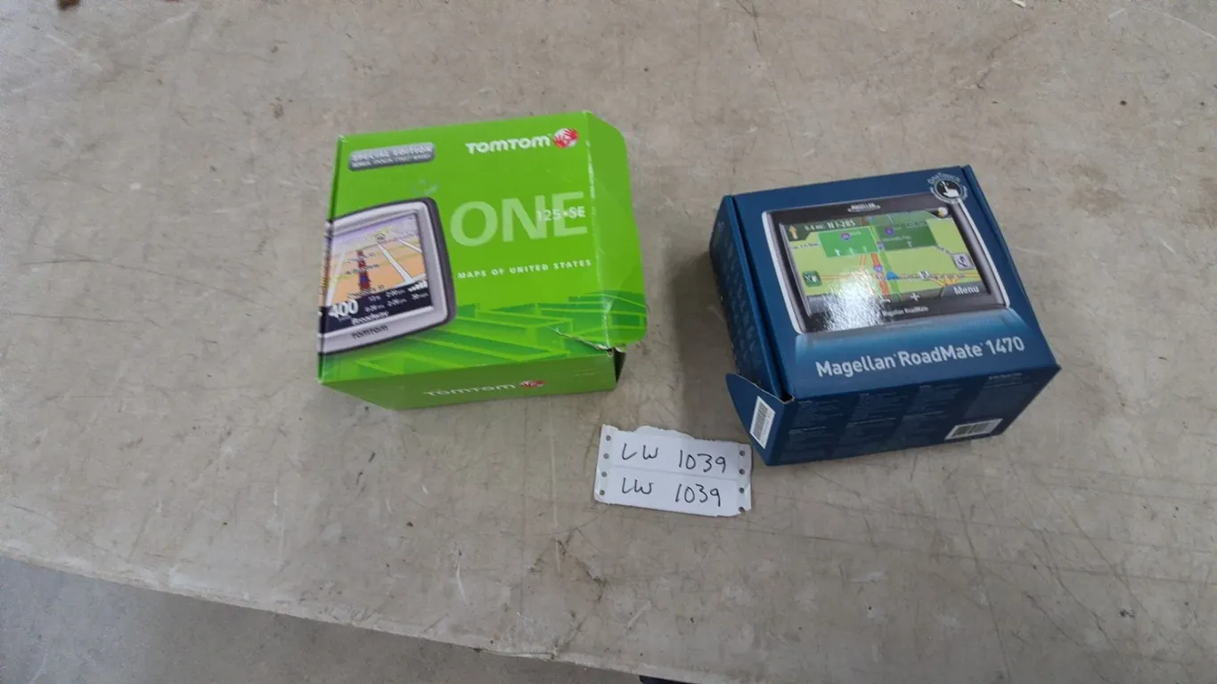 TomTom ONE 125 SE GPS and Magellan RoadMate 1470 GPS in Original Pkgs. 1 new 1 used