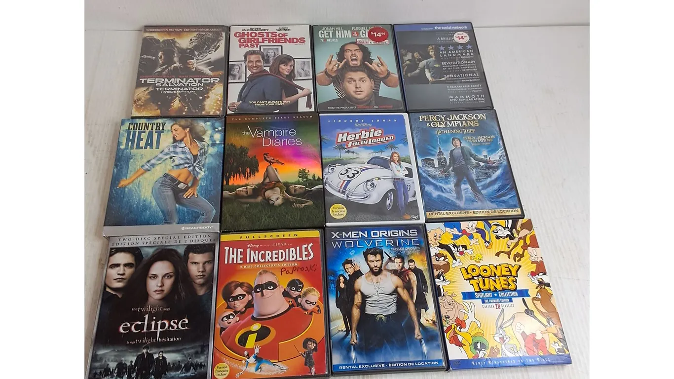 (12) DVD Movies - The Incredibles, Thje Social Network, The Vampire Diaries