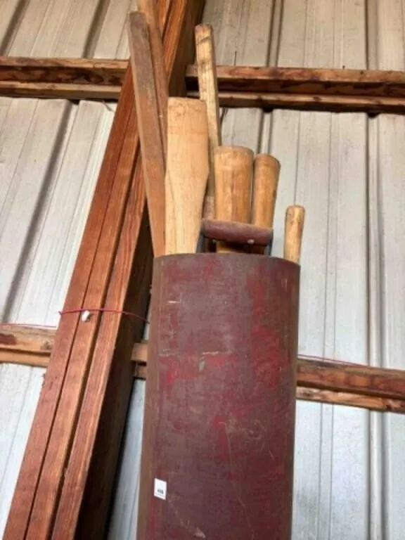 Light metal bin containing wood handles