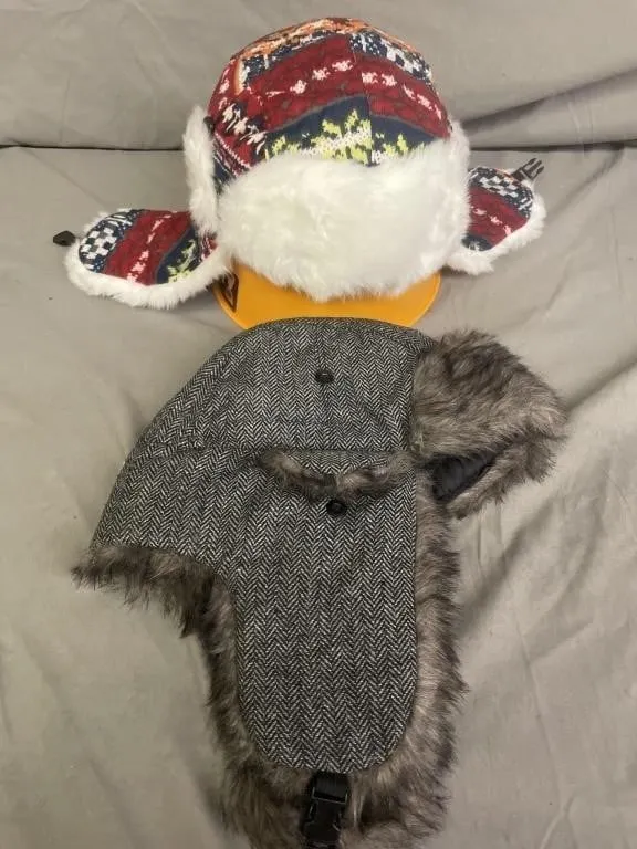 NEW � Two trapper-style winter hats with faux fur