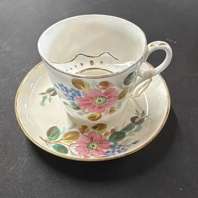 Antique Porcelain Teacup and Saucer with Moustache