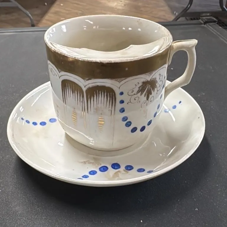 Antique Porcelain Cup and Saucer Set with Gold Tri