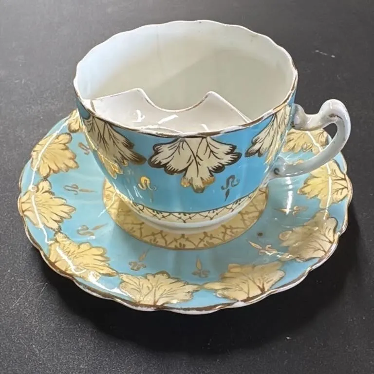 Antique Blue and Gold Mustache Cup and Saucer Set
