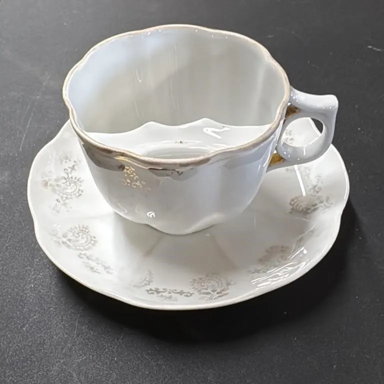 Antique Porcelain Mustache Cup and Saucer Set