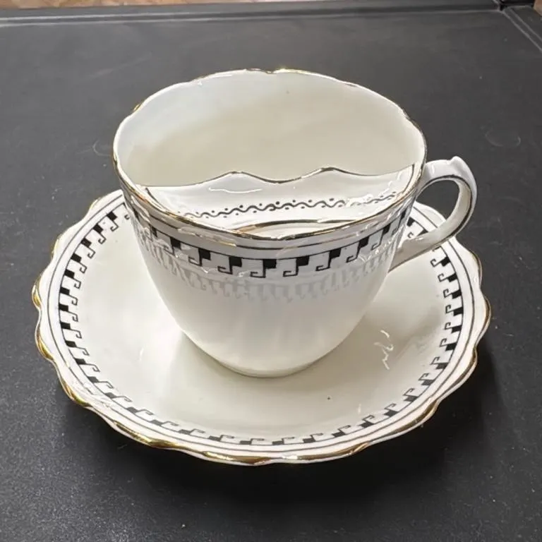Vintage Porcelain Tea Cup and Saucer Set with Gold