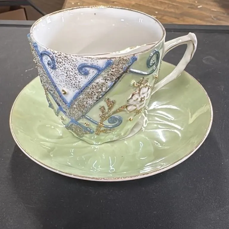 Vintage Green Teacup and Saucer Set with Ornate De