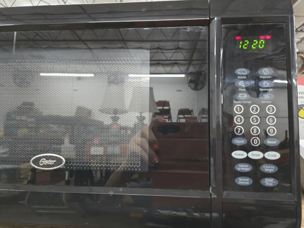 Oster Black Digital Countertop Microwave Oven