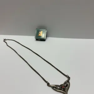 Decorative Metal Necklace with Pentacle and Red Gem Detail and Vintage WHS Music Pin with Original C