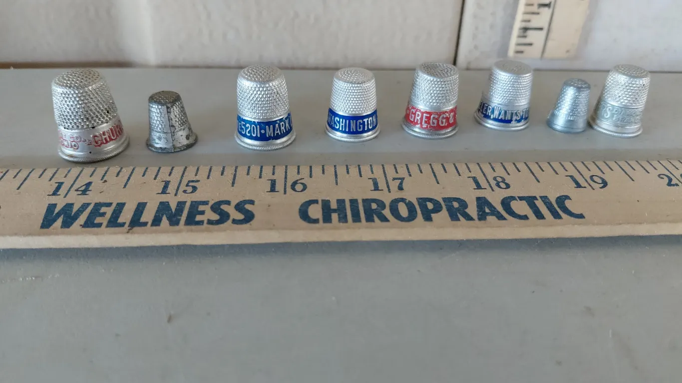 8 Vintage Metal Advertising Thimbles