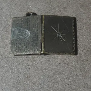Unmarked Rectangular Book-Form Locket Pendant with Starburst Engraving and Clear Stone Accent, Hinge