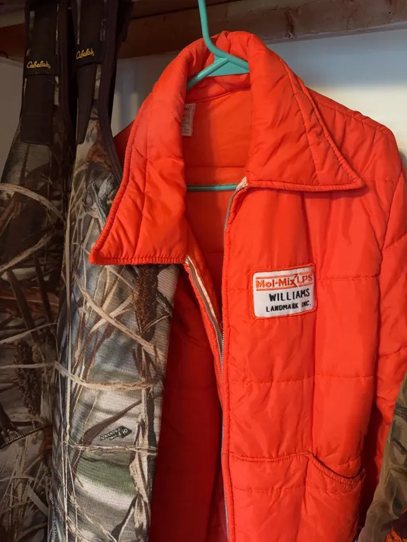 Cabela's Camouflage Neoprene Chest Waders and Cap'n Jac Safety Orange Puffer Coat