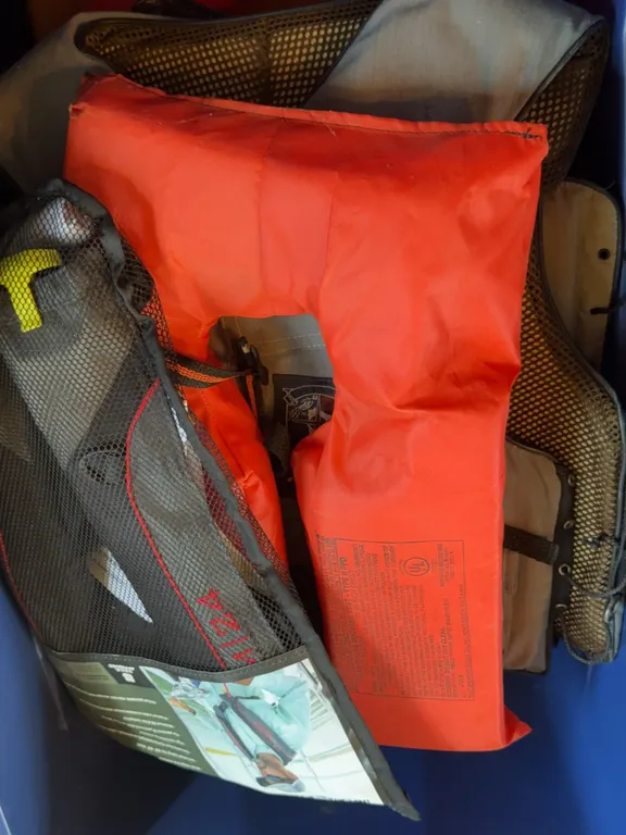 Assorted Life Vests PFDs Fishing Vests and Boat Safety Gear