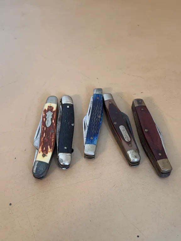 Collection of Five Folding Pocket Knives Including Case and Schrade