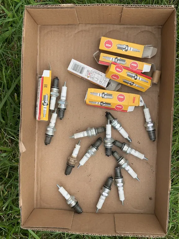 Assorted NGK D8EA Spark Plugs with Original Packaging