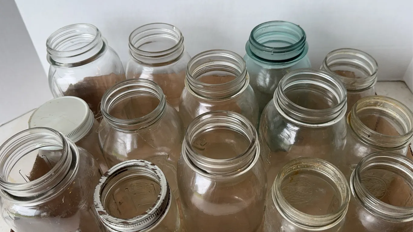 Collection of Glass Canning Mason Jars in Gatorade Box