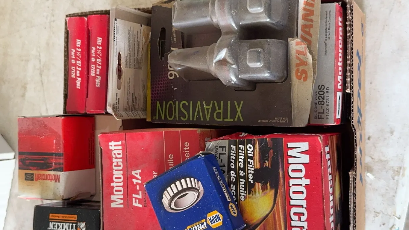 Assorted Automotive Maintenance Parts Including Motorcraft Oil Filters and Bearings