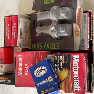 Assorted Automotive Maintenance Parts Including Motorcraft Oil Filters and Bearings