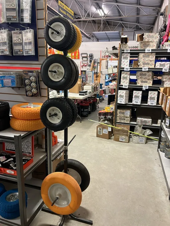 NEW/UNUSED TIRE DISPLAY RACK w/ 9 - TIRES ON WHEELS