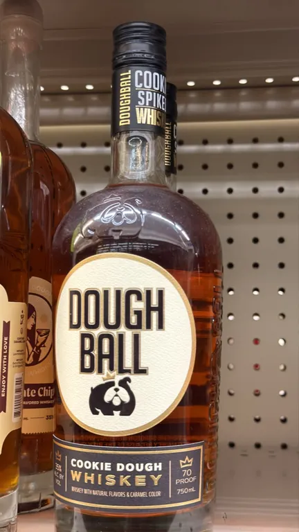 Flavored whiskey assortment. Includes (2) Jo Jo cookie dough chocolate chip flavored whiskey bottles (750 mL, 35% ABV, 70 proof) and (3) Dough Ball co