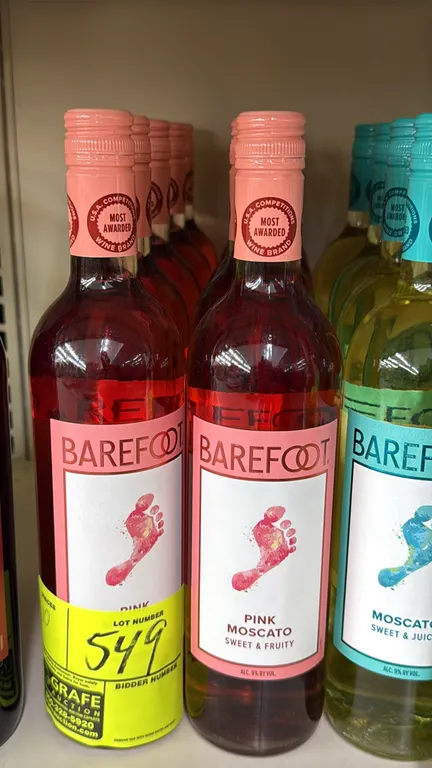Barefoot California Pink Moscato sweet and fruity wine. 750ml bottles. 9% ABV. Features screw-cap closures. Liquor can only be picked up and removed b