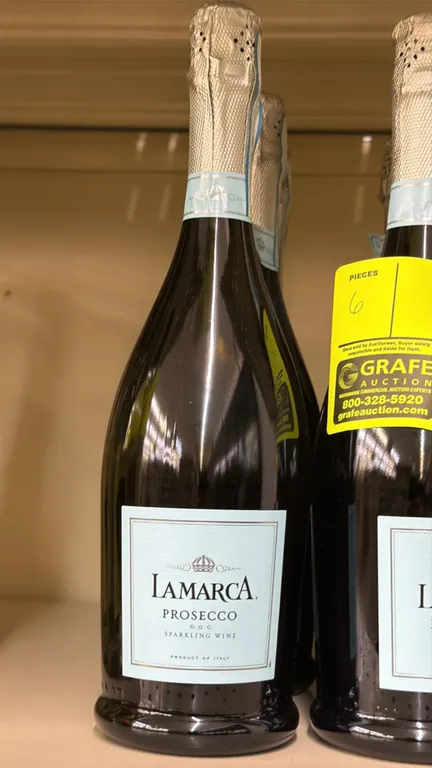 LaMarca Prosecco D.O.C. sparkling wines. Features 750 mL glass bottles with foil seal. Extra dry, 11% ABV. Product of Italy. Liquor can only be picked