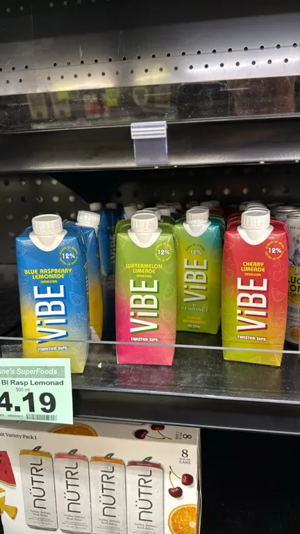 Vibe by Vendange Twisted Sips assorted wine cocktail cartons. Flavors include Blue Raspberry Lemonade, Watermelon Limeade, Classic Margarita, and Cher