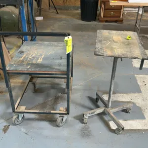 Metal shop cart and portable metal work table lot. Includes 28" shop cart with top push handle and 24" adjustable-style rolling work table. Both mount