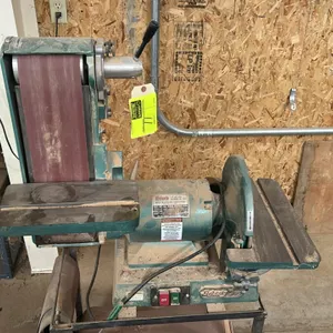 Grizzly Industrial G-1183 combination belt and disc sander/grinder. Features an adjustable sanding belt assembly, disc sander, dual work tables with m