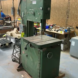 Powermatic 81 vertical bandsaw. Features cast iron work table, adjustable blade guide, side dust chute, and power switch box. S/N: 66-3112.