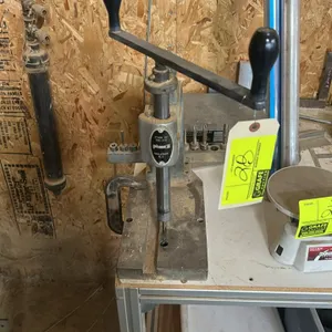 Phase II 265-110 benchtop manual hand tapper. Features cast iron C-frame construction, dual-handle upper crank, adjustable spindle assembly, and slott