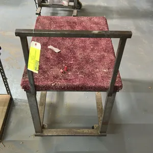 Metal shop cart. Features a carpet-padded top platform and integrated push handle. 32"H. Mounted on swivel casters.