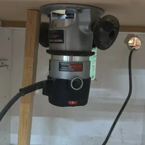 Porter-Cable 690 series 1-3/4 HP fixed-base corded router. Features an under-table mount setup and includes installed bit.