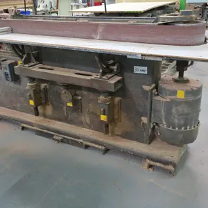 Curtis 91-6 horizontal belt sander. Features a 175" x 6" sanding belt, work support table, dust collection port, rear belt storage rack with spare bel