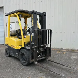 Hyster H50FT Fortis LP-gas forklift. Features 3-stage mast, side shift, 48" forks, 42" carriage, overhead guard, and solid tires. 5,000 lb capacity, 1