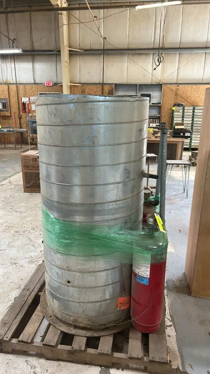 Spiral galvanized steel ductwork section. Features an integrated access door, base flange, and (2) attached pneumatic actuator cylinders. 30" x 62".