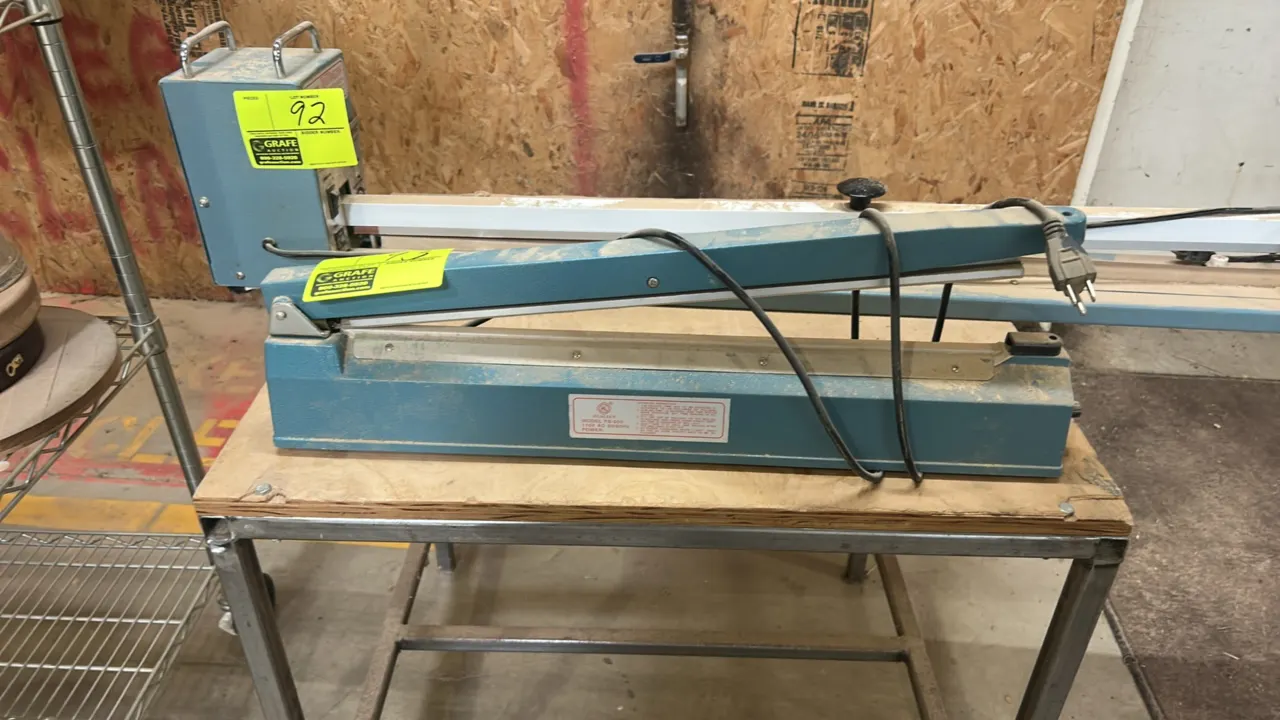 Hualian FS-500 manual tabletop impulse heat sealer. Features adjustable sealing timer control dial. Electrical: 110V, 50/60 Hz. Table not included.